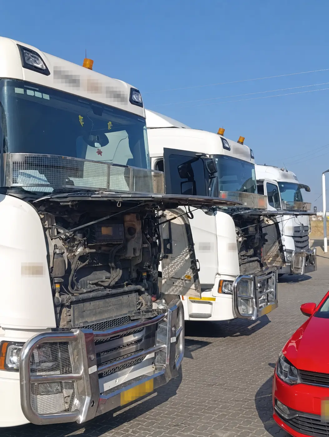 Three Scania G410 fleet trucks receiving AdBlue system work