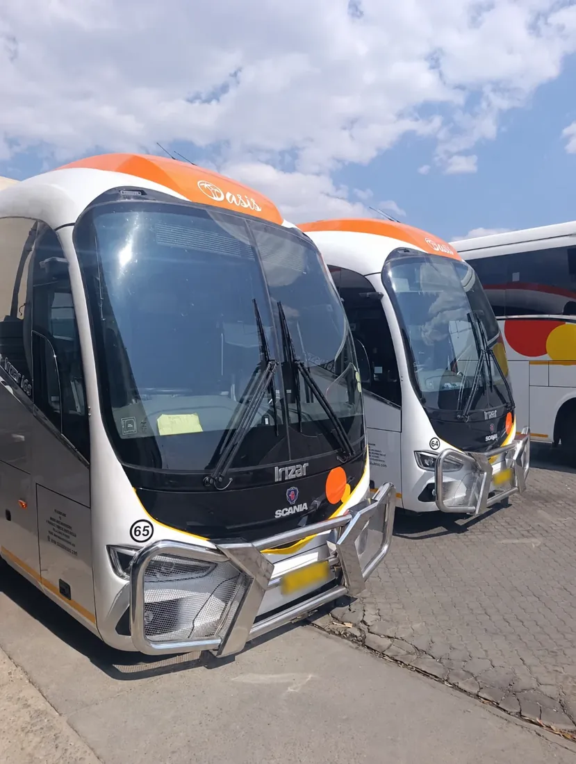 Two Oasis Irizar-bodied Scania coaches, with registration plates blurred
