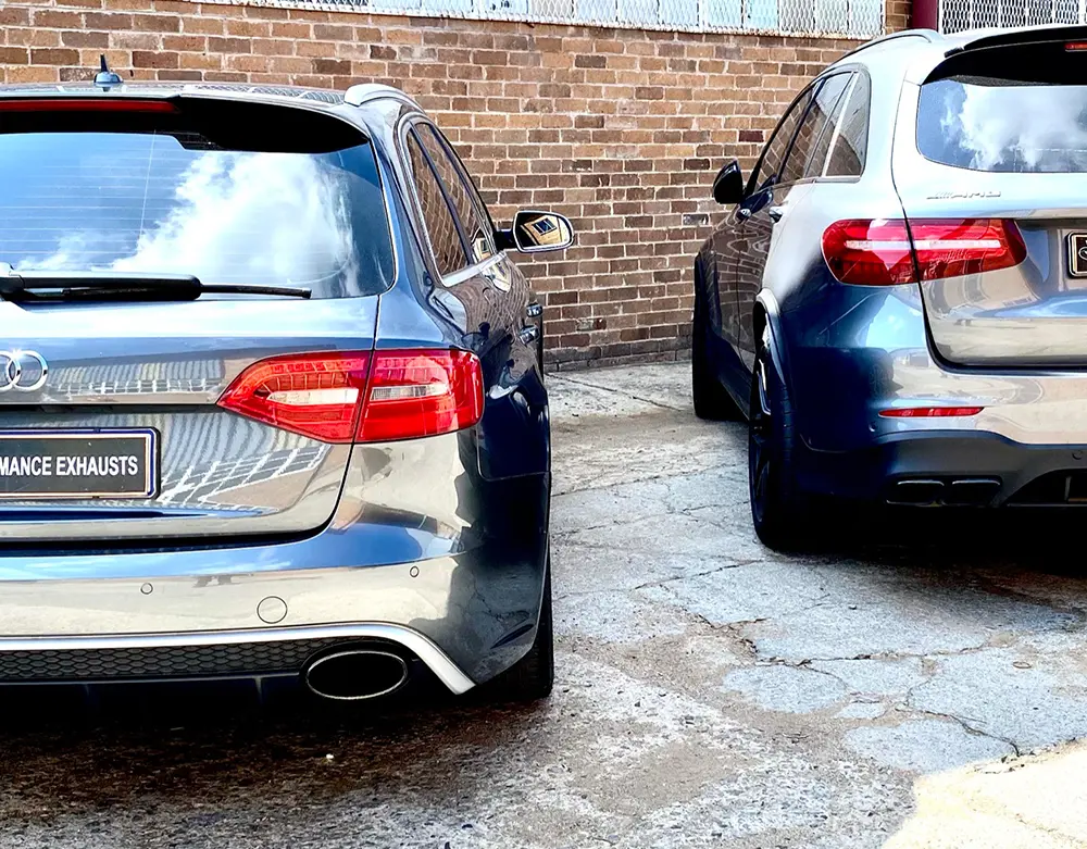Rear exhaust outlets on Audi and Mercedes-Benz passenger vehicles